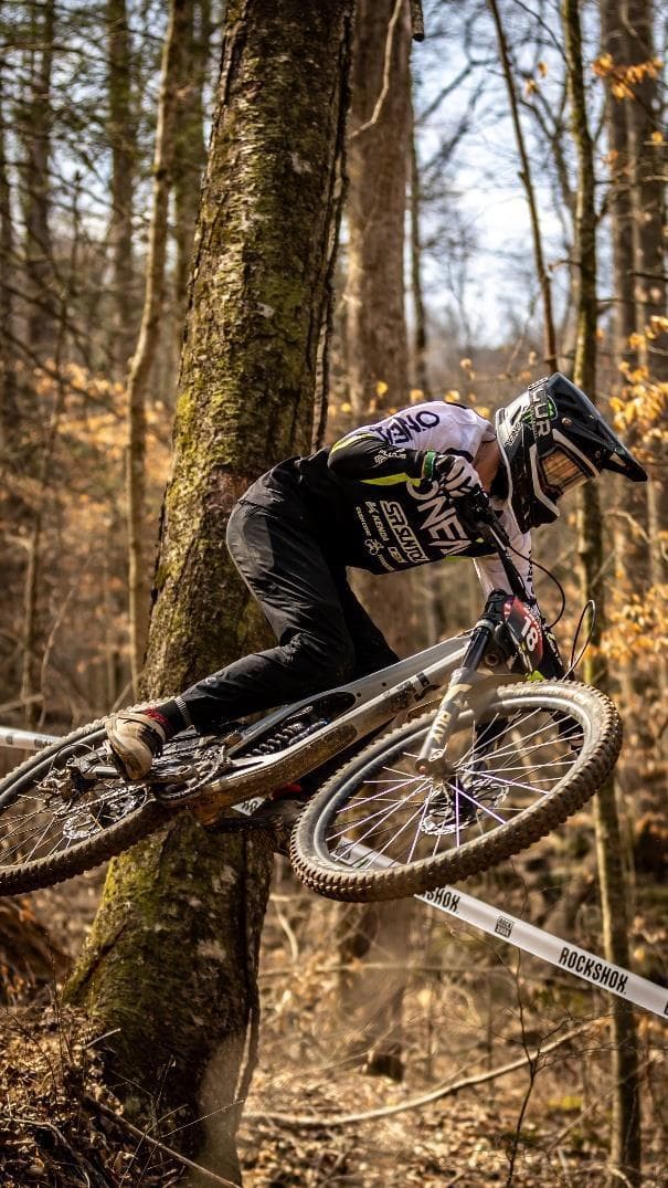 Chris Liebig racing through fall woods